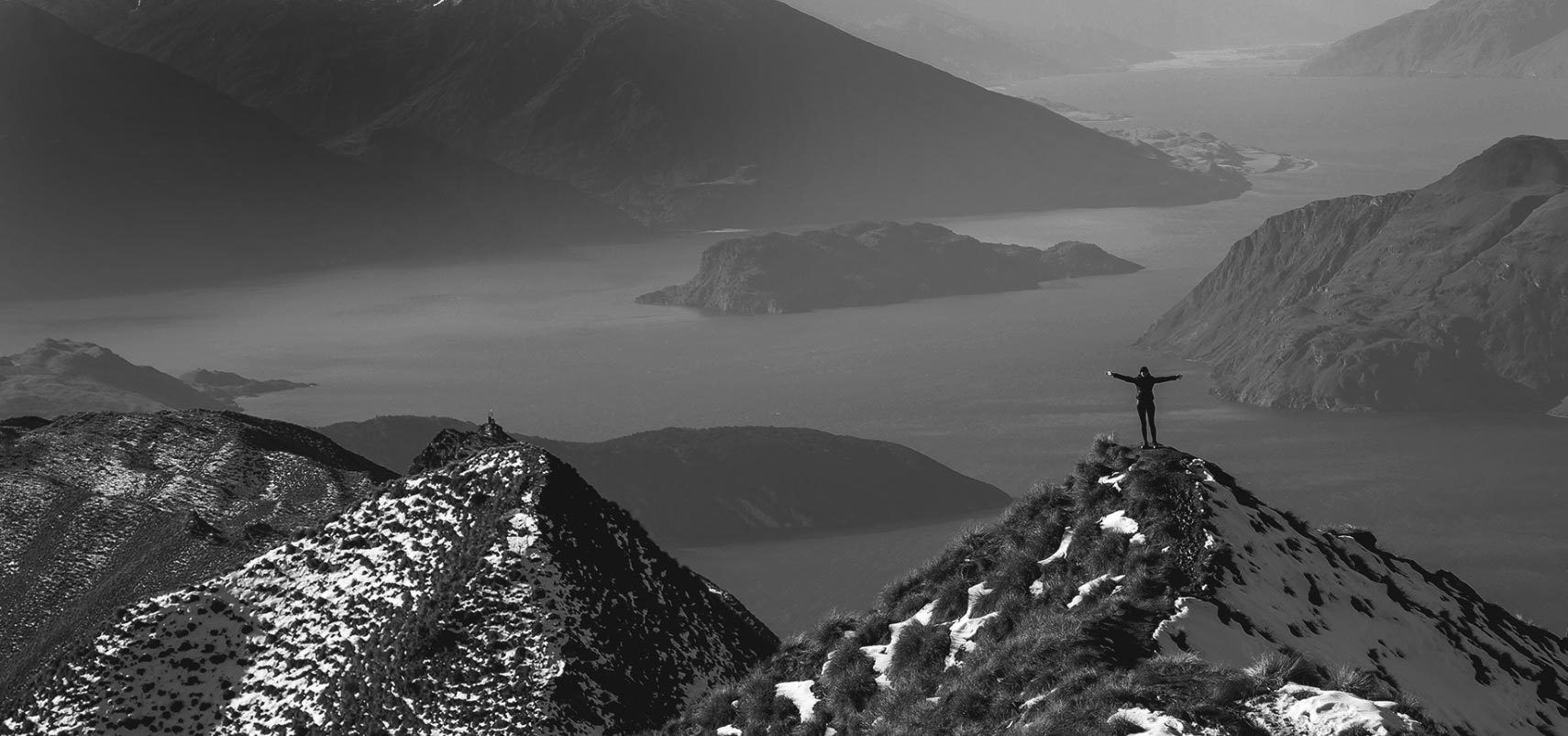 Photograph of a person rejoicing on a mountain