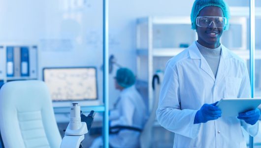 Photograph of an African doctor with tablet PC in lab